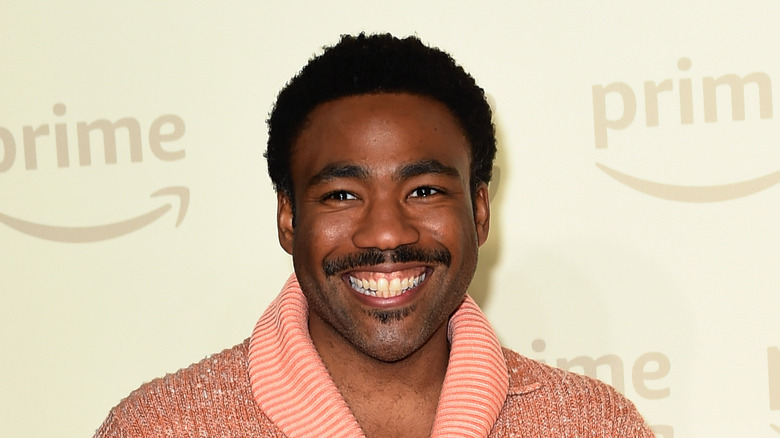 Donald Glover mustache pink shirt