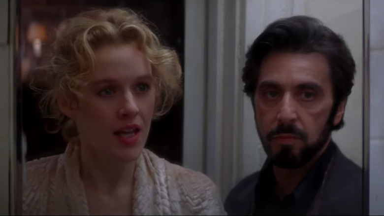 Penelope Ann Miller and Al Pacino looking in mirror