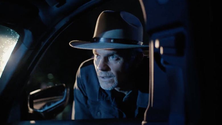 Timothy Olyphant peeking through car window