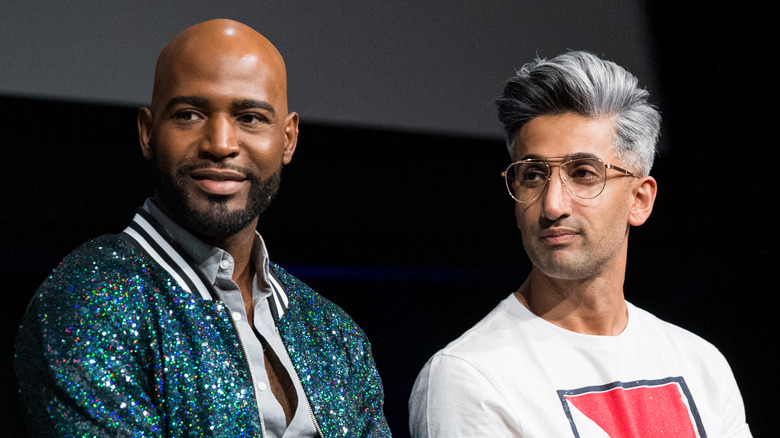 Tan France and Karamo Brown listening