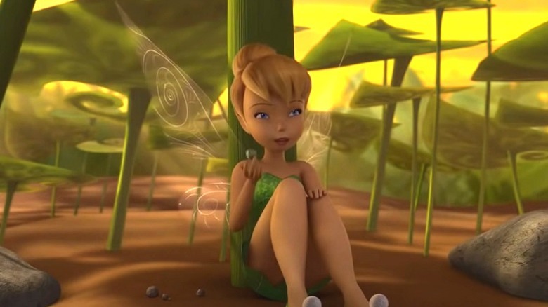 Tinker Bell sitting under a leaf