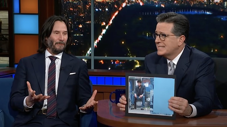 Keanu Reeves and Stephen Colbert sitting