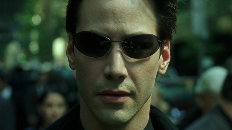 Neo wearing sunglasses