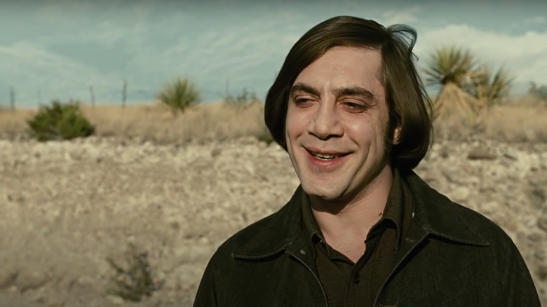 Anton Chigurh smiling with desert backdrop