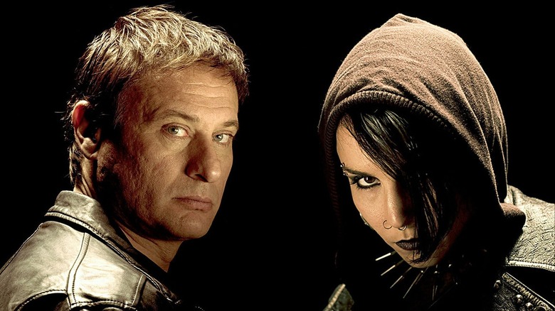 Blomkvist and Lisbeth Salander posing