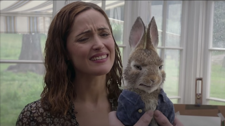 Rose Byrne in Peter Rabbit holding Rabbit