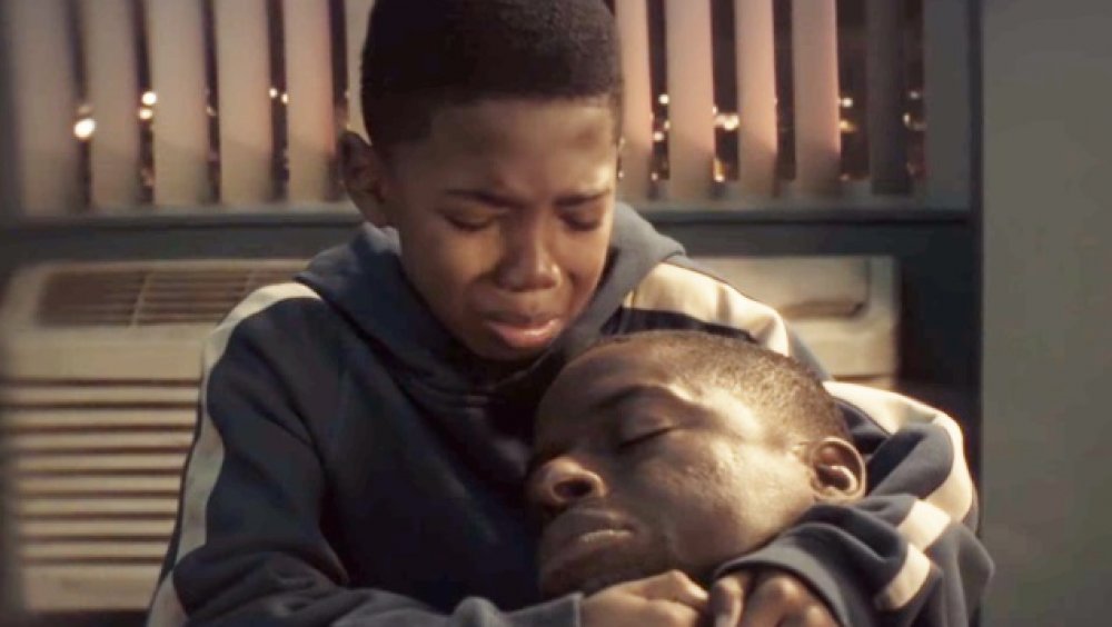 Seth Carr and Sterling K. Brown as Young Erik and N'Jobu in Black Panther