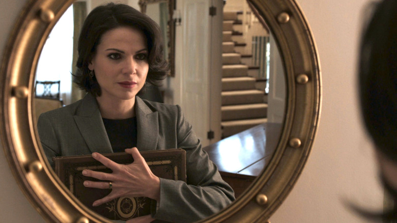 Regina Mills looks at her reflection