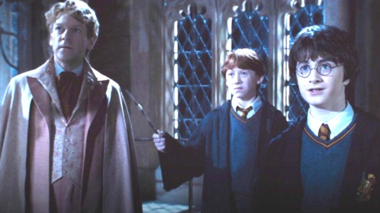 Lockhart, Ron, and Harry going into the Chamber of Secrets