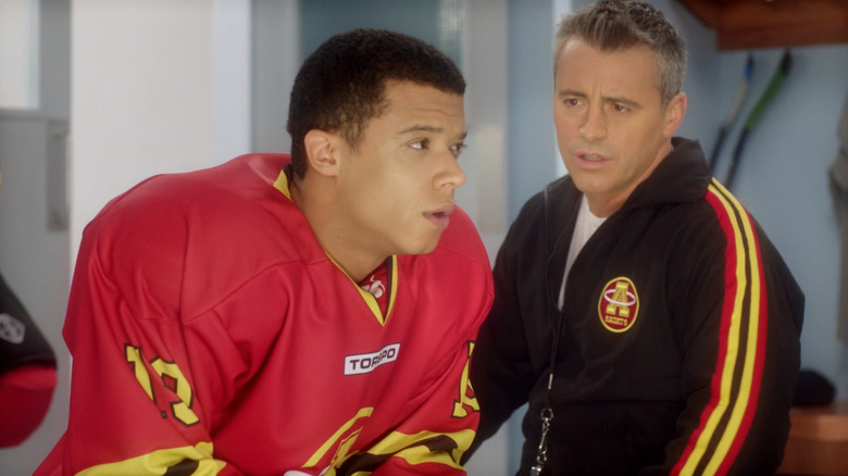 Jacob Anderon in hockey uniform with Matt LeBlanc