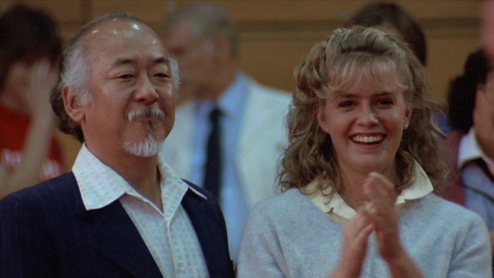 Pat Morita as Mr. Miyagi and Elizabeth Shue as Ali Mills in The Karate Kid