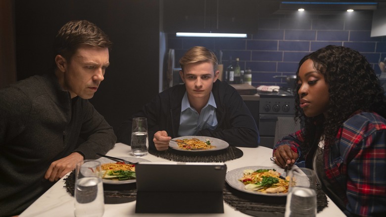 Ian, Alex, and Jack eating dinner