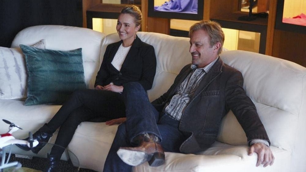 Juliette Barnes and Glenn Goodman sitting on a couch