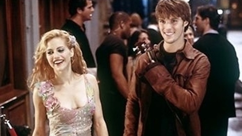 Brittany Murphy and Jesse Spencer in leather coat