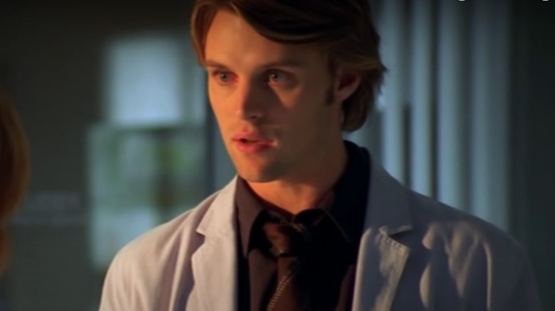 Jesse Spencer in doctor's coat