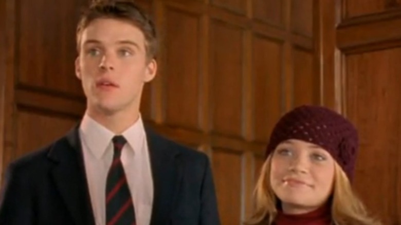 Jesse Spencer in suit with Ashley Olsen in hat