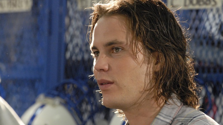 Tim Riggins looking on