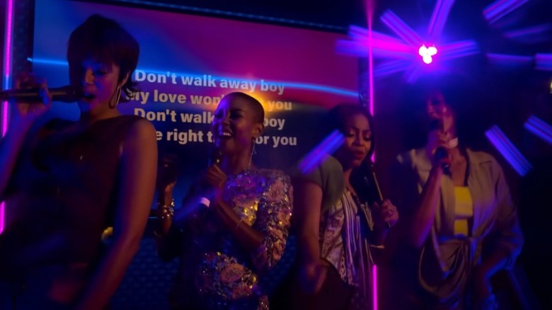Whitney, Ella, Renee and Sondi singing at a karaoke