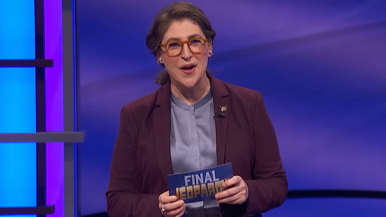 Mayim Bialik talking with Jeopardy! card