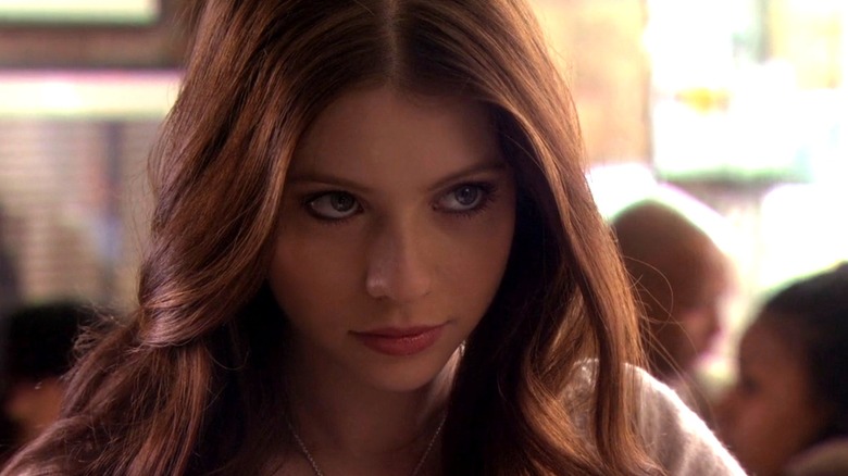 Georgina Sparks (Michelle Trachtenberg) looking up from her book on Gossip Girl