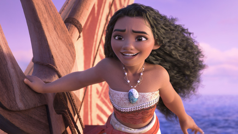 Moana smiling while sailing her ship