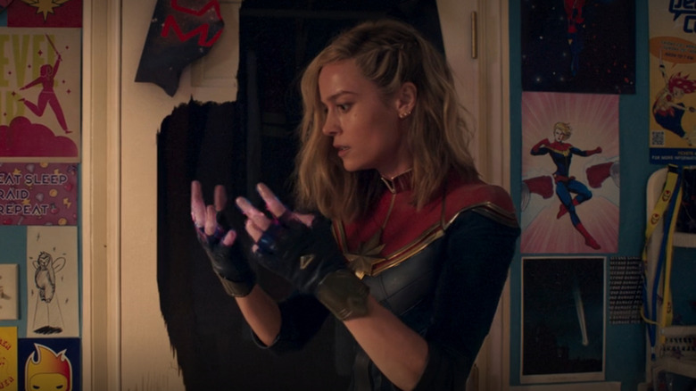 Captain Marvel looks at hands