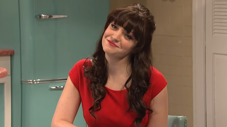 Abby Elliott as Zooey Deschanel looking ready to give advice