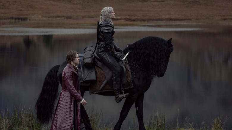 Geralt riding horse Jaskier walking