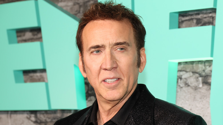 Nicolas Cage slightly smiling