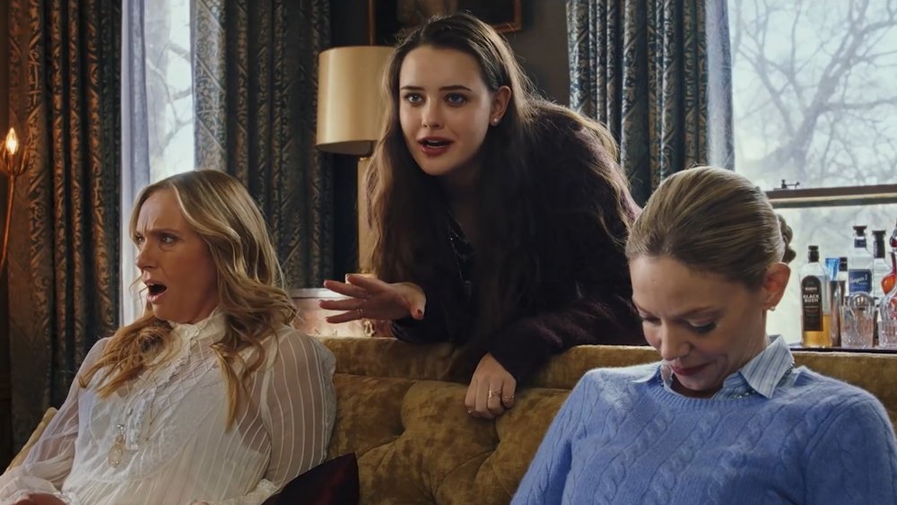 Toni Collette as Joni Thrombey, Katherine Langford as Meg Thrombey, and Riki Lindhome as Donna Thrombey in Knives Out