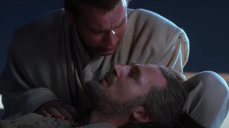 Obi-Wan holds a dying Qui-Gon Jinn