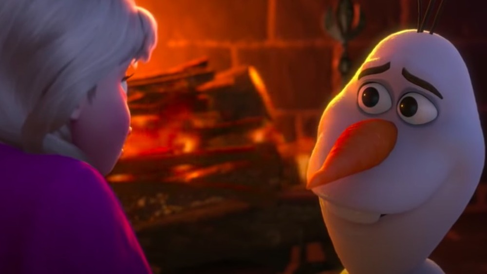 Olaf and Anna in front of the fire in Frozen