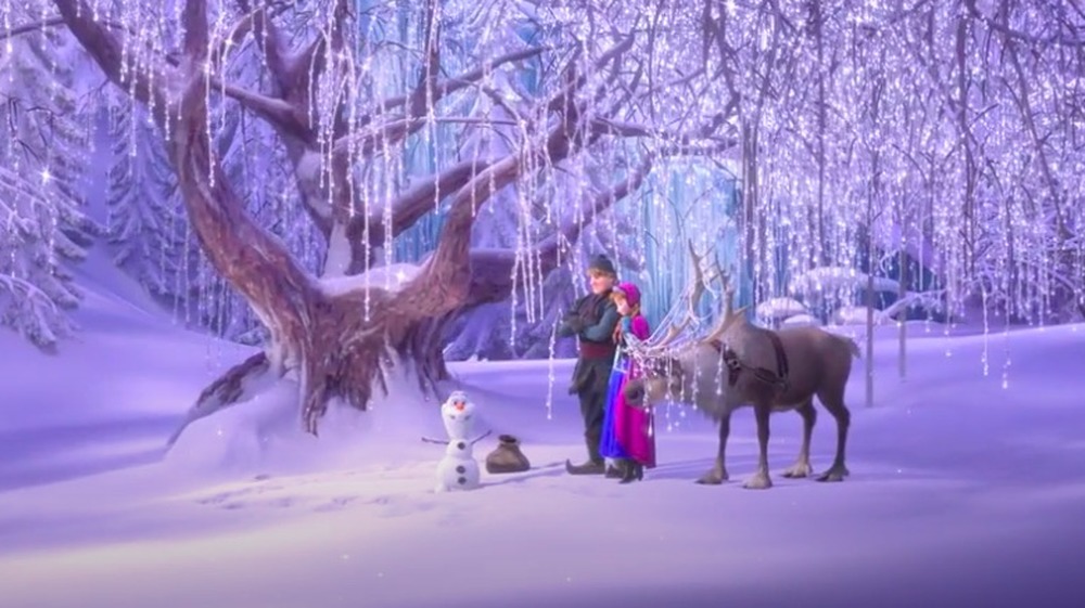 Olaf, Anna, Kristoff, and Sven trek through the forest in Frozen