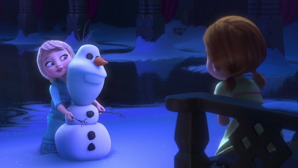 Young Elsa builds Olaf as Anna looks on, in Frozen