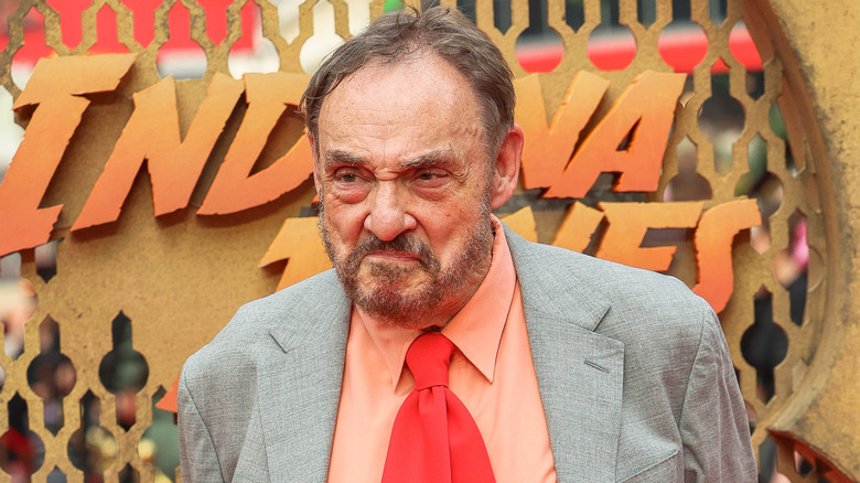 John Rhys-Davies smirking