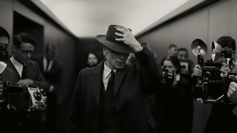 Oppenheimer surrounded by paparazzi