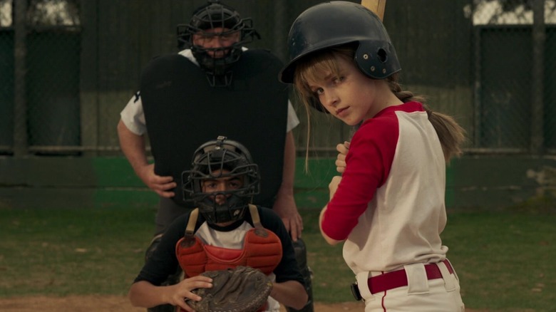 Young Carol Danvers at bat