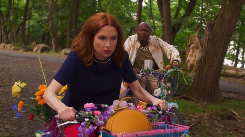 Kimmy and Titus riding bikes in Unbreakable Kimmy Schmidt