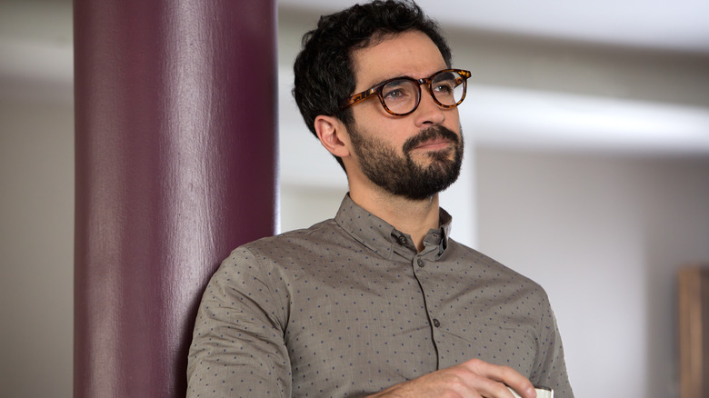 Hernando holding a coffee mug