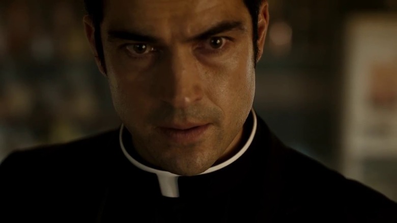 Father Tomas looking determined