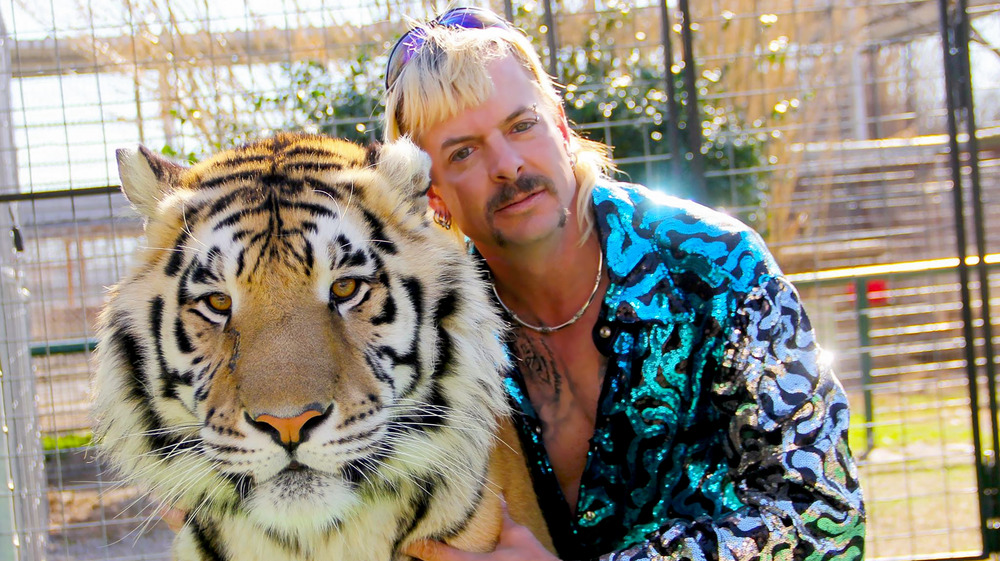 Joe Exotic posing with tiger