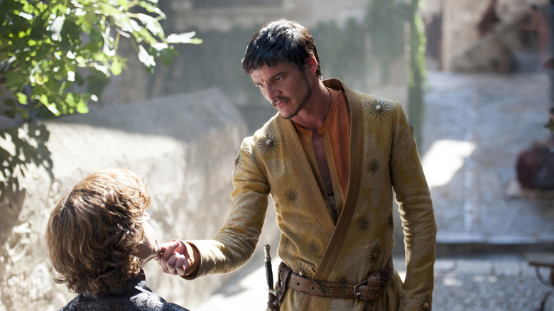 Oberyn touches Tyrion's chin