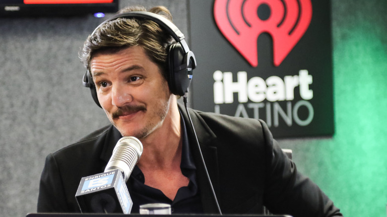 Pedro Pascal recording a podcast