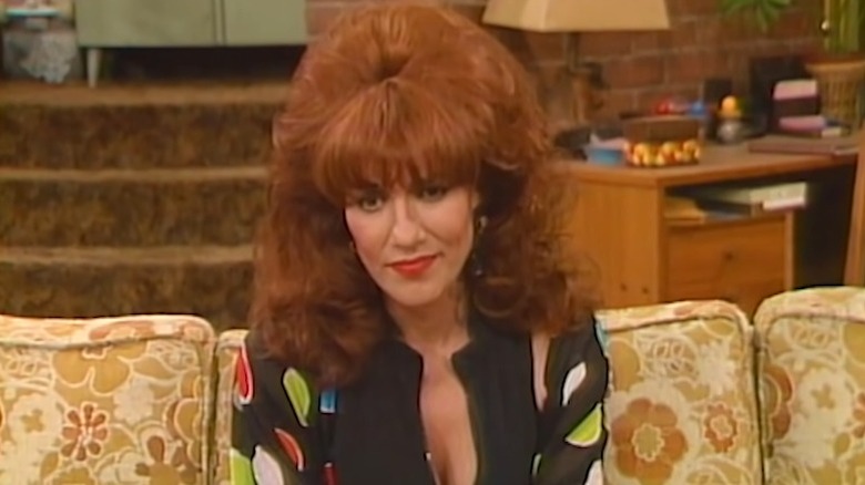 Peggy Bundy sitting on couch