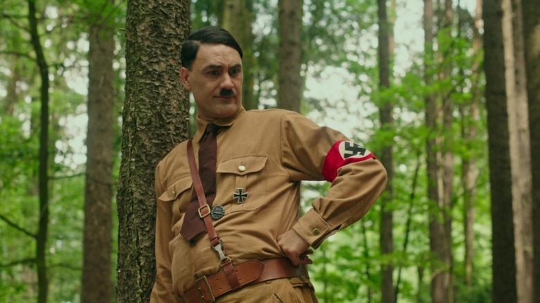 Adolf with hand on hip