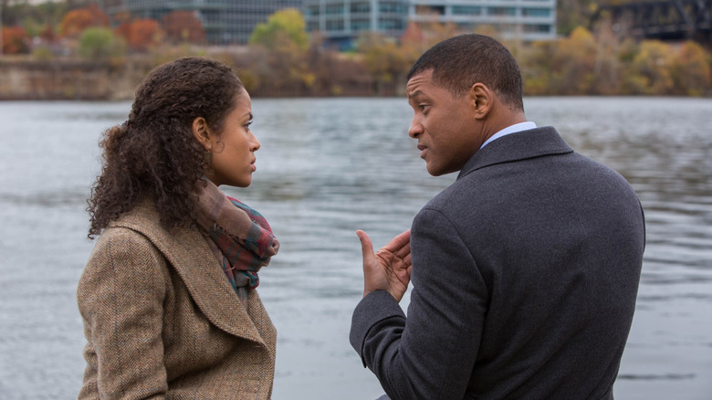 Prema and Bennett sitting by river talking