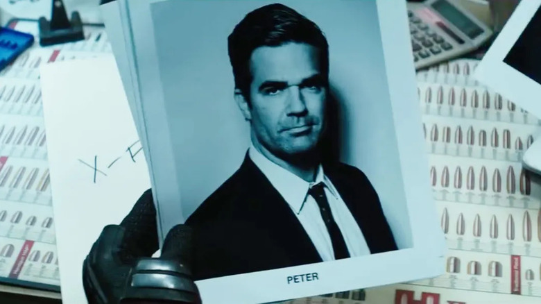 Deadpool holds photo of Peter