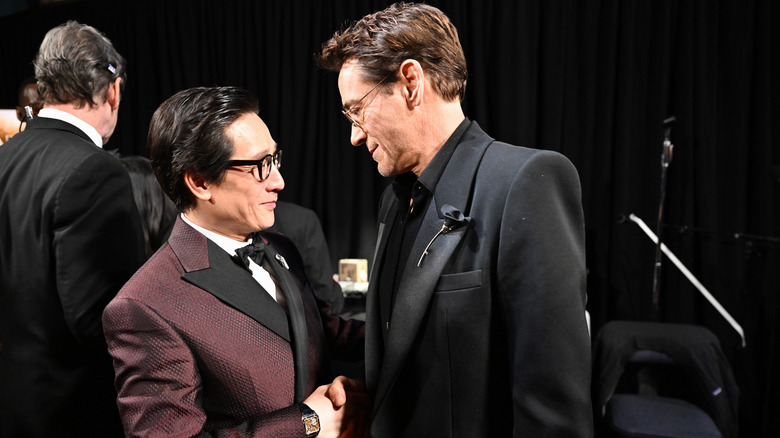 Robert Downey Jr. shaking hands with Ke Huy Quan