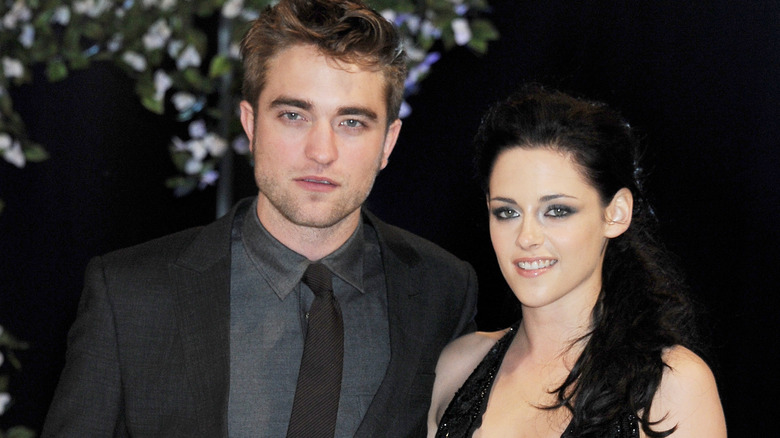 Robert Pattinson and Kristen Stewart smiling