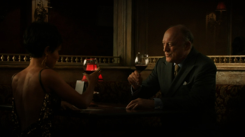 Carmine Falcone drinks wine